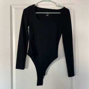 Black, long sleeved bodysuit with square neck. Great material!